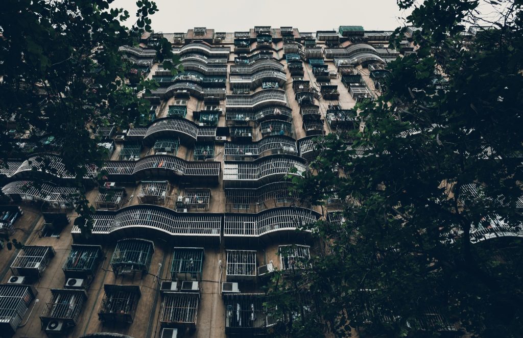 Why are luxury apartments becoming popular in urban areas?